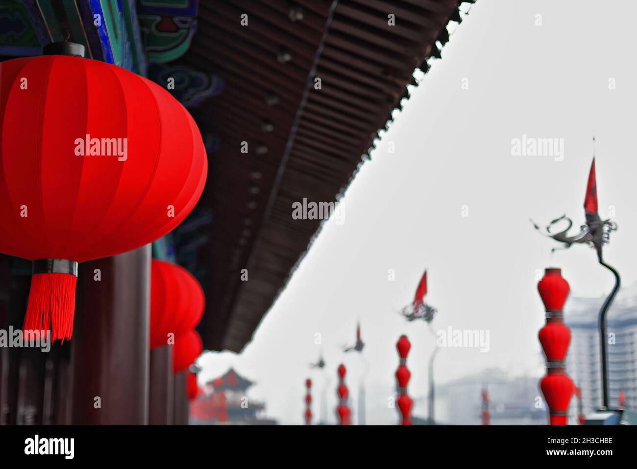 Chinese lanterns on sentry building-iron flagpole-City Wall's Yongning-South Gate. Xi'an-China-1609 Stock Photo