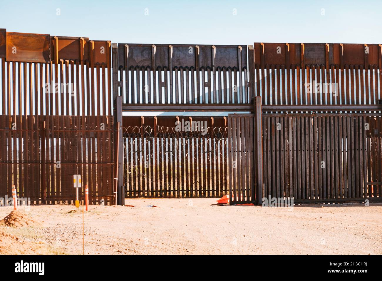 a gate in the steel US-Mexico border wall in Naco, Arizona Stock Photo