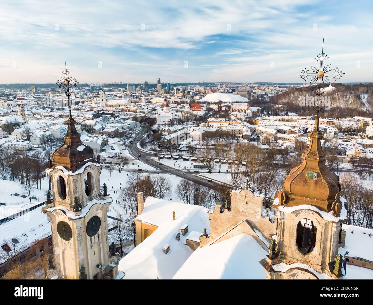 Beautiful Vilnius city panorama in winter with snow covered houses ...