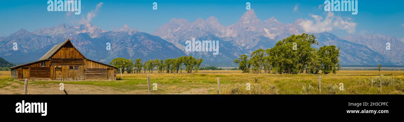 wooden barn on Mormon Row historic district  with the Teton Mountain Range in the background Stock Photo