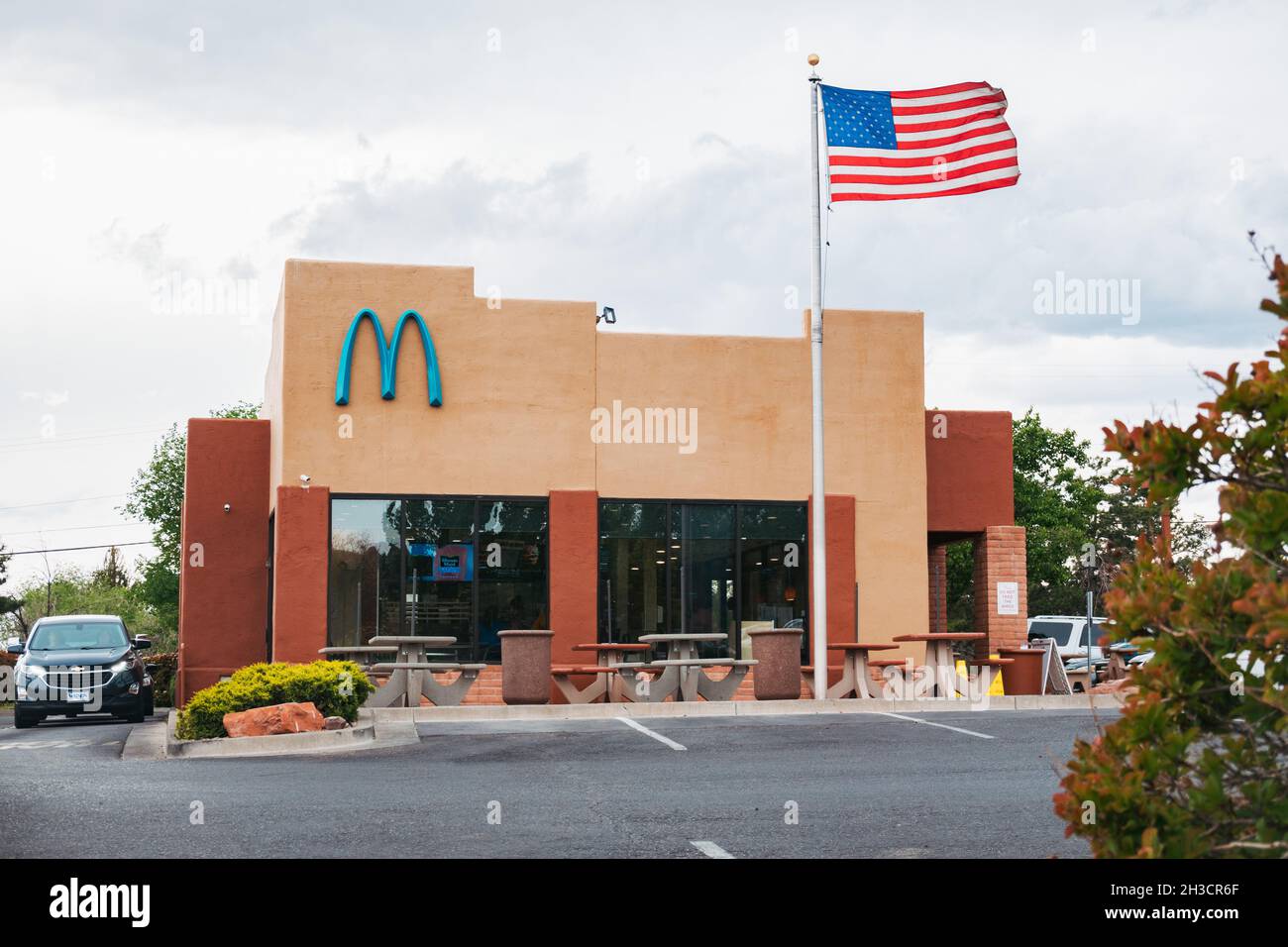 a McDonald's with 'blue arches' in Sedona, AZ. Local regulations on building colors meant swapping the usual golden yellow for turquoise blue Stock Photo