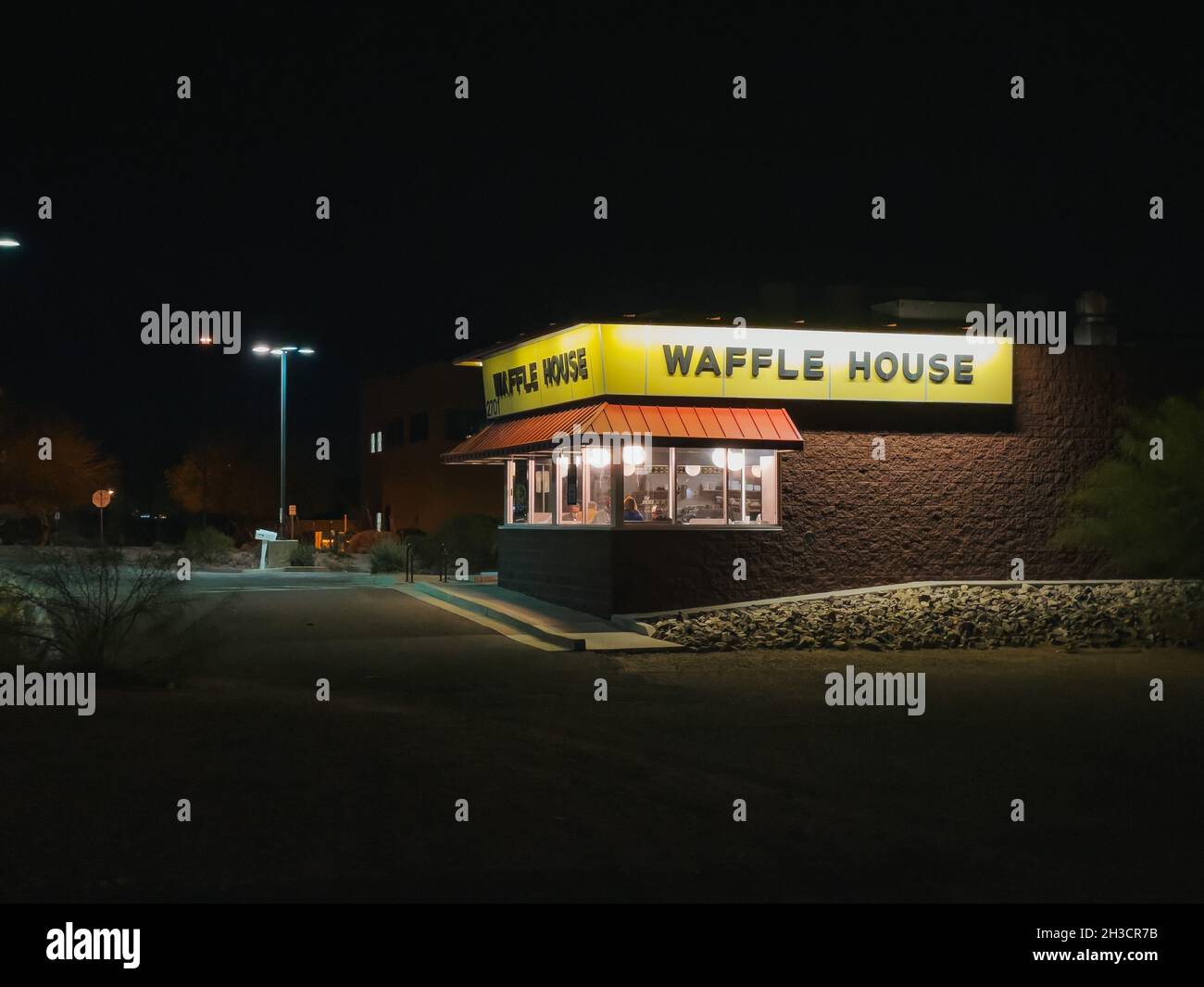 a Waffle House restaurant at night in Tucson, Arizona, United States of America Stock Photo