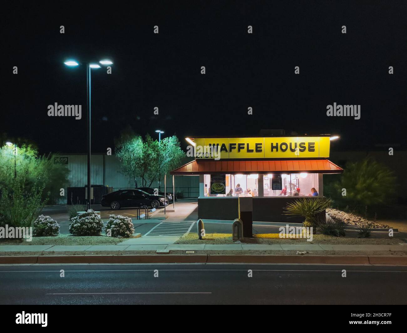 a Waffle House restaurant at night in Tucson, Arizona, United States of America Stock Photo