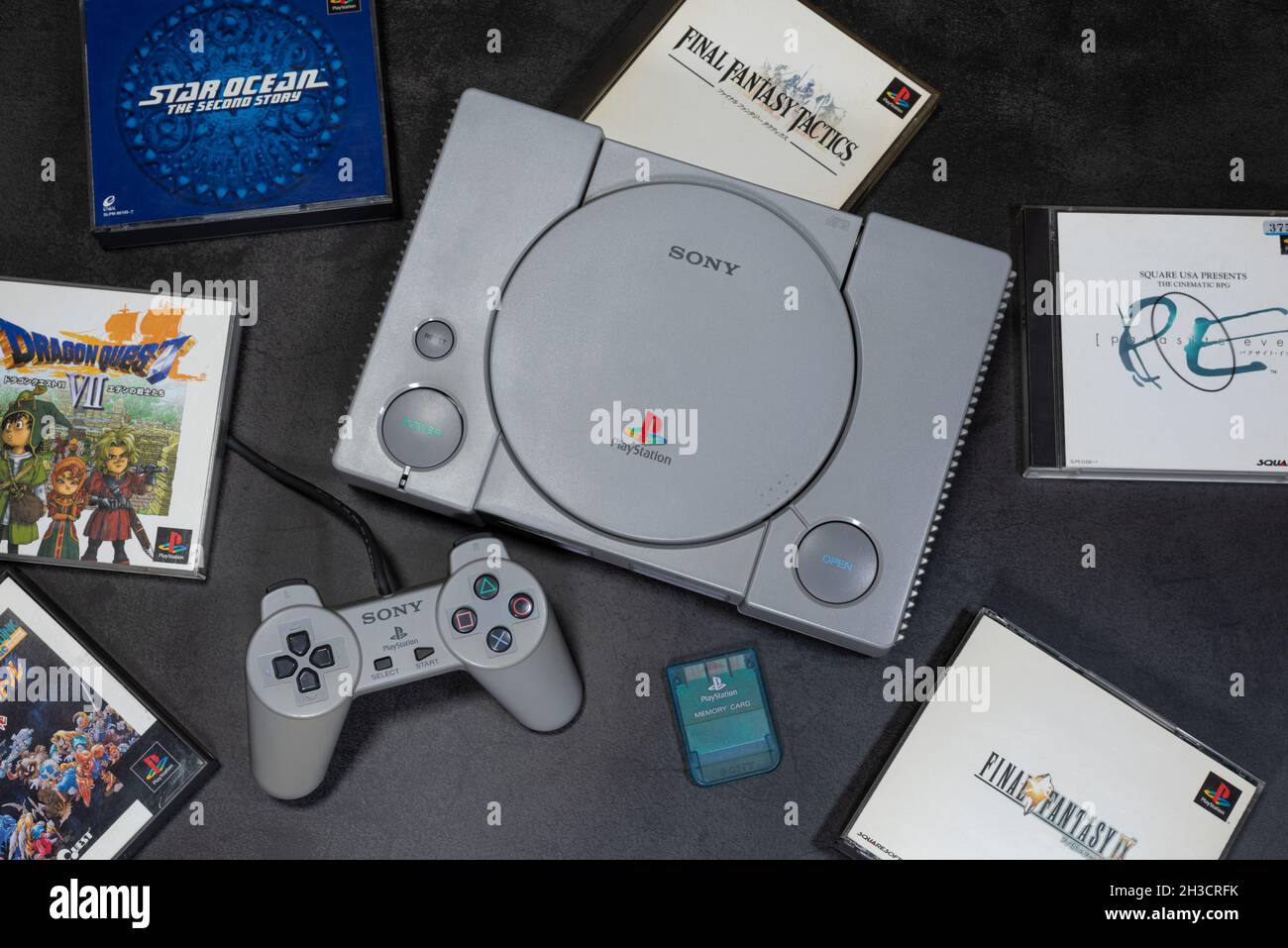 Fukuoka, Japan - october 24, 2021 : the original sony playstation 32-bit home video game console released in 1994 with some games and controller Stock Photo