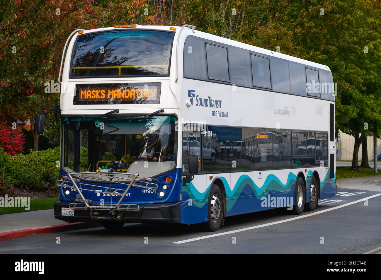 Everett, WA, USA - October 18, 2021; A Sound Transit double decker bus parked at Everett Station displaying the message Masks Mandatory Stock Photo