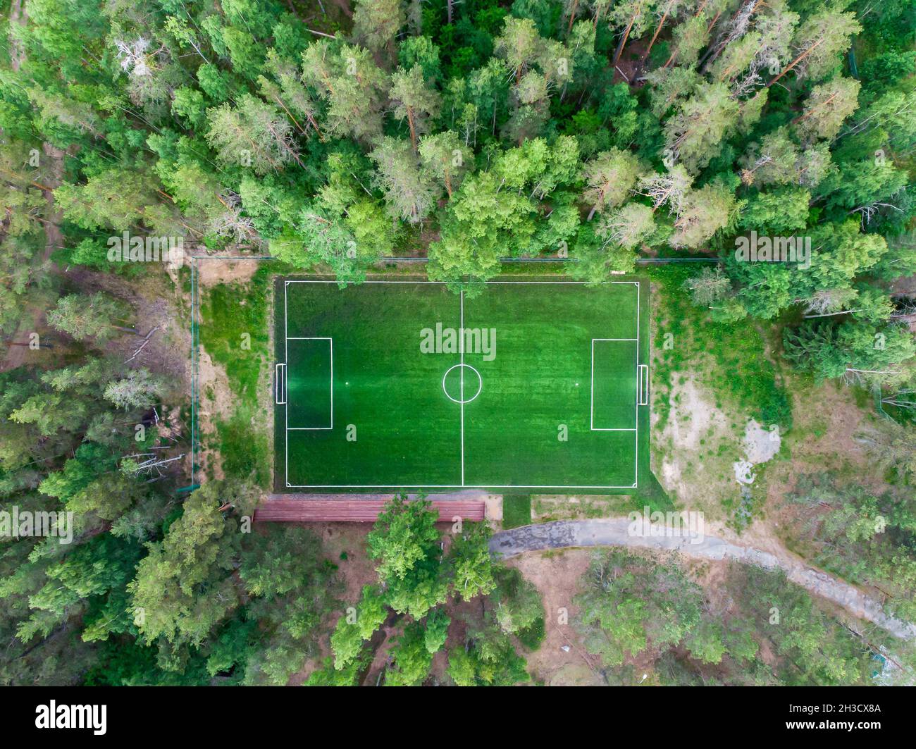 Aerial drone view of football soccer pitch field, green grass summer