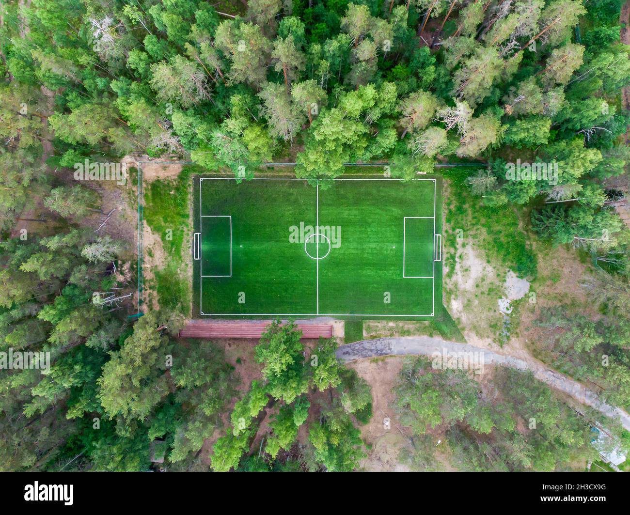 Aerial drone view of football soccer pitch field, green grass summer