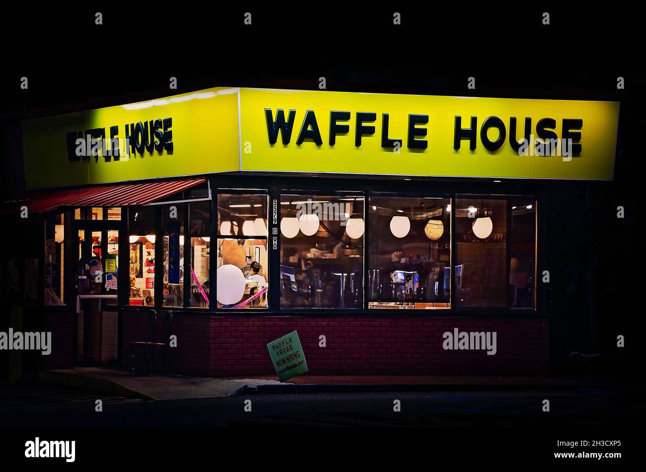 A  Waffle House restaurant is pictured at dusk, Oct. 23, 2021, in Mobile, Alabama. Stock Photo