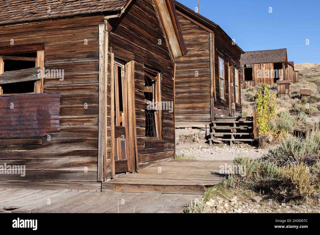 Houses sit along Green Street in the ghost town of Bodie at Bodie State Park. Stock Photo