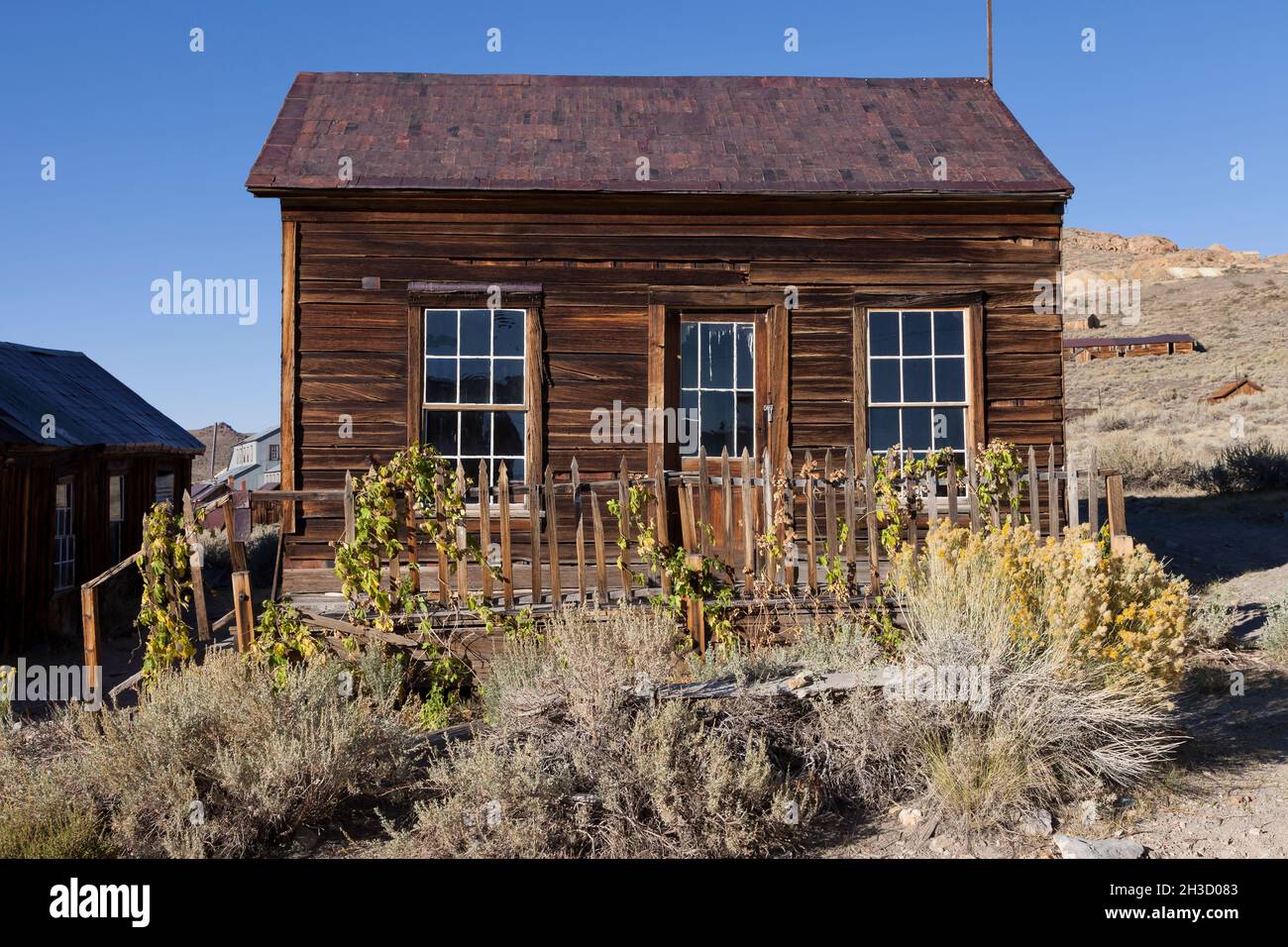 House with a picket fence along Green Street in the ghost town of Bodie at Bodie State Park. Stock Photo