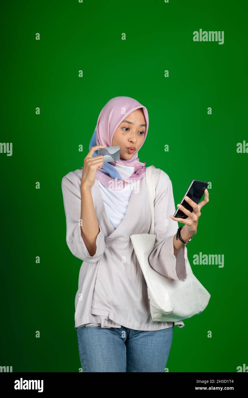 Woman in hijab happy using mobile phone for video call Stock Photo - Alamy