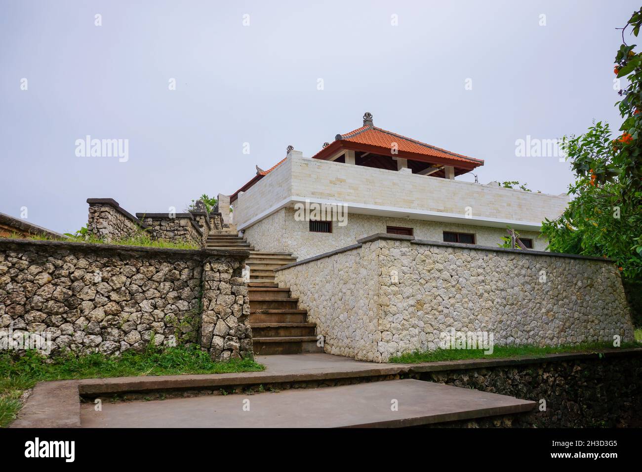 Building exterior of other part or section of Balinese hindu Uluwatu temple in Bali Indonesia with clear blue sky background. No people. Stock Photo
