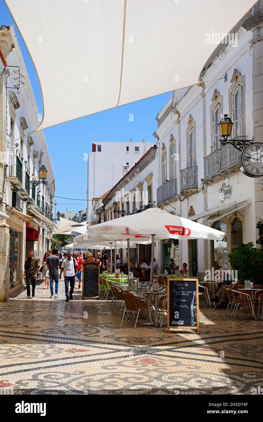 View along the R de Santo Antonio lined with restaurants and shops in ...