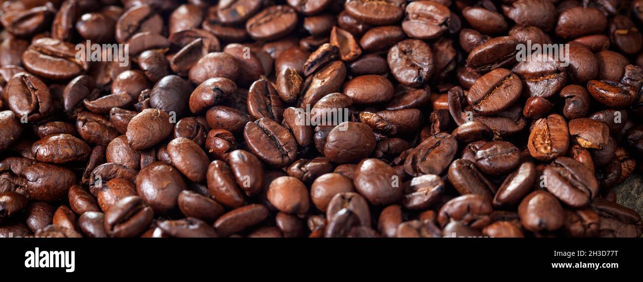 Brown roasted coffee beans background. Close up view with details Stock ...
