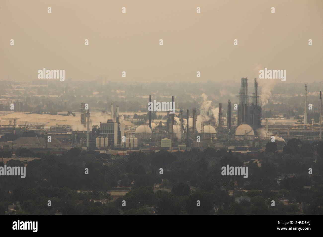 Global warming emissions from oil refining pollute the sky with C02. Stock Photo