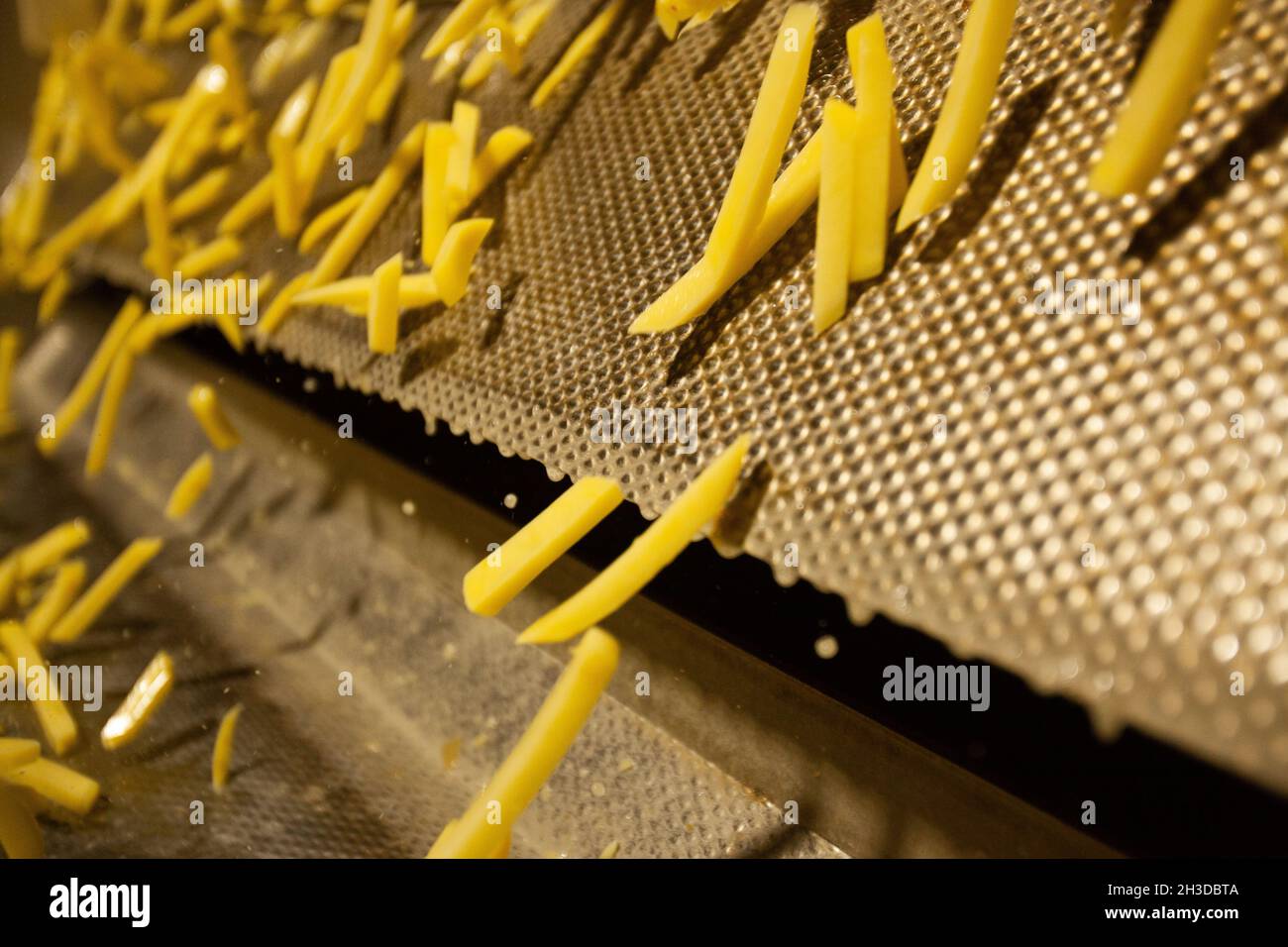 Production line of a potato factory. French fries fast food Stock