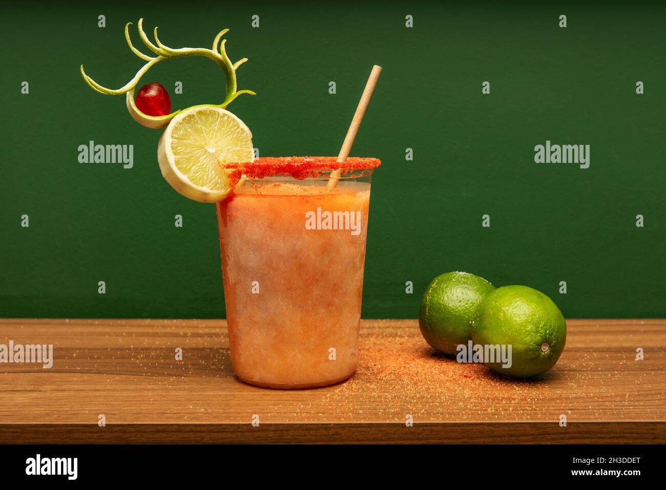 Large plastic glass with margarita cocktail with passion fruit, whole