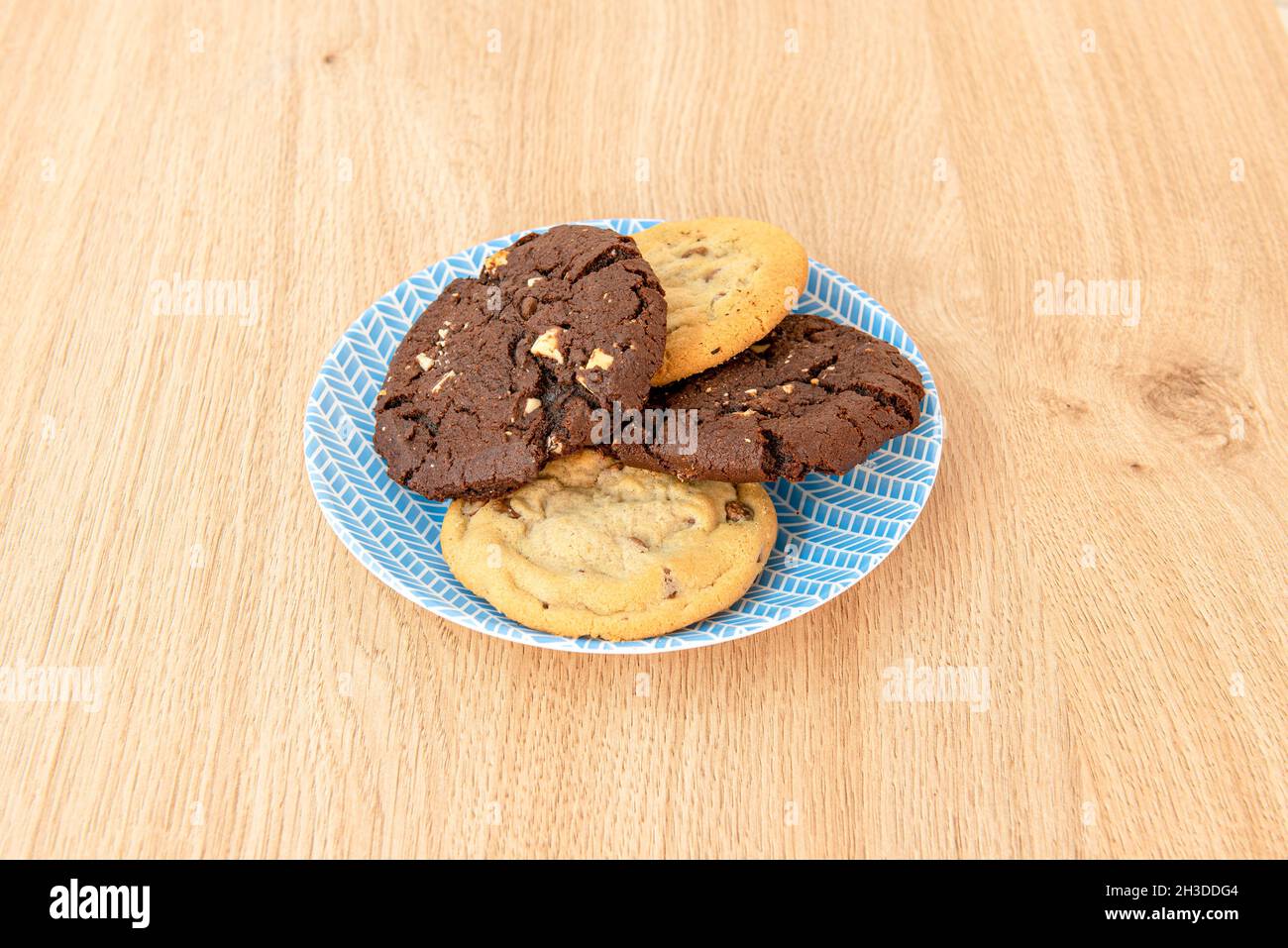 Assorted white and dark chocolate cookies with nuts and fruit chips Stock Photo