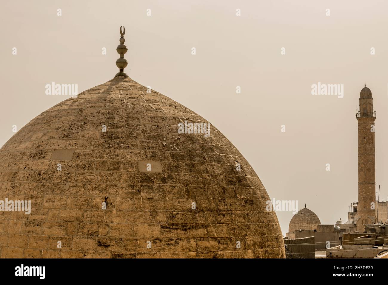 domes of muslim mosques in the stone city of Mardin in Mesopotamia, Turkey Stock Photo