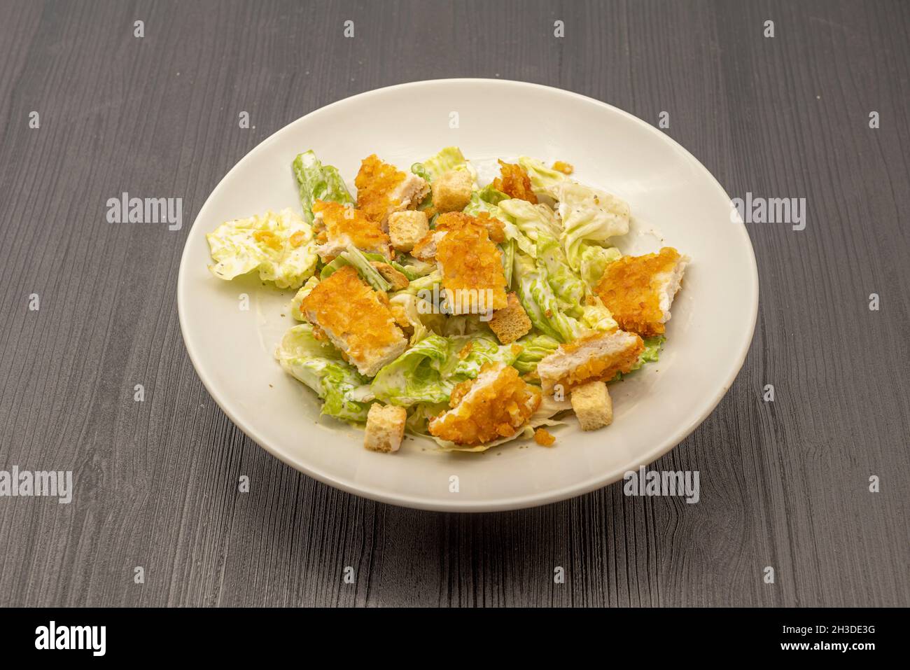 Caesar salad with crispy breaded fried chicken Stock Photo Alamy