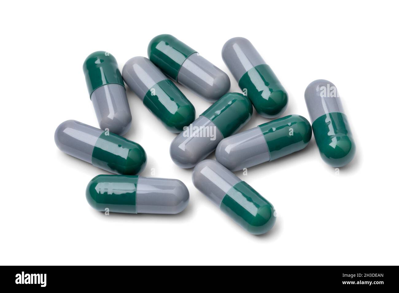 Heap of medical capsules close up isolated on white background Stock Photo