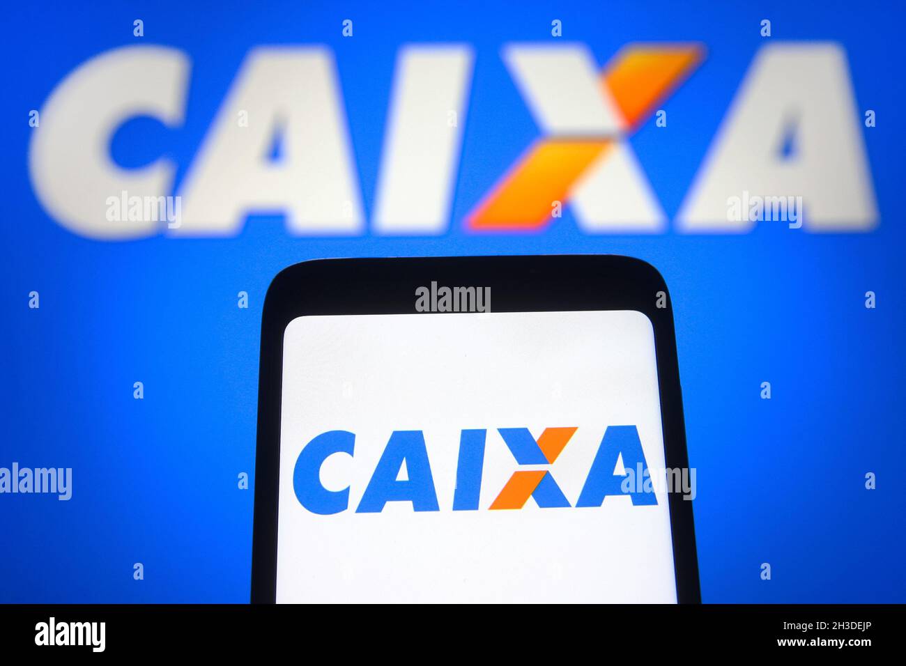 In this photo illustration, Caixa Economica Federal logo seen displayed on a smartphone and in the background. (Photo by Pavlo Gonchar / SOPA Images/Sipa USA) Stock Photo