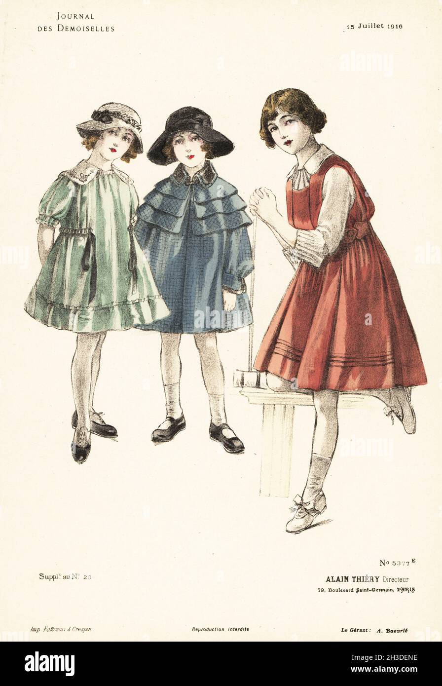 Young girls playing croquet, WWI. They wear short pinafore dresses, cloche caps, ankle socks and shoes. One in a short carrick cape or coachman's coat. Handcoloured lithograph by Fattorini & Crespin from Alain Thiery’s fashion magazine Journal des Demoiselles, 79 Boulevard Saint-Germain, Paris, France, July 15, 1916. Stock Photo