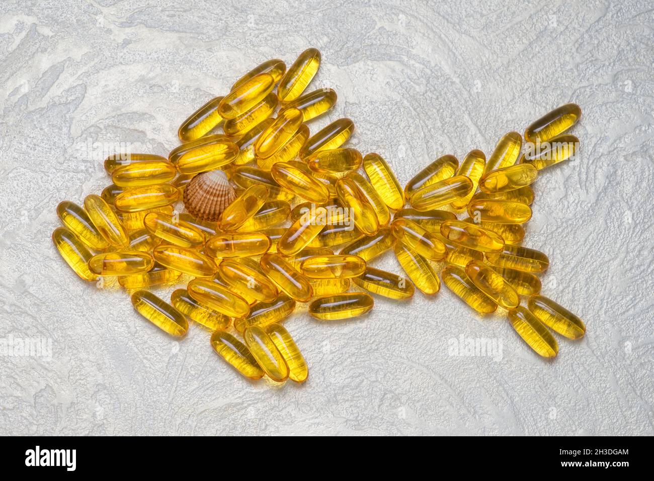 Omega3 capsules in fish shape. EPA and DHA are essential fatty substances that our bodies need on a daily basis. Stock Photo