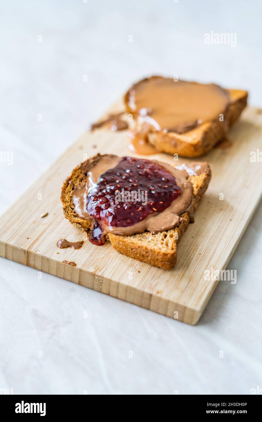 A Kraft peanut butter and jelly or jam sandwich is seen in studio, 2014.  (Adrien Veczan Stock Photo - Alamy