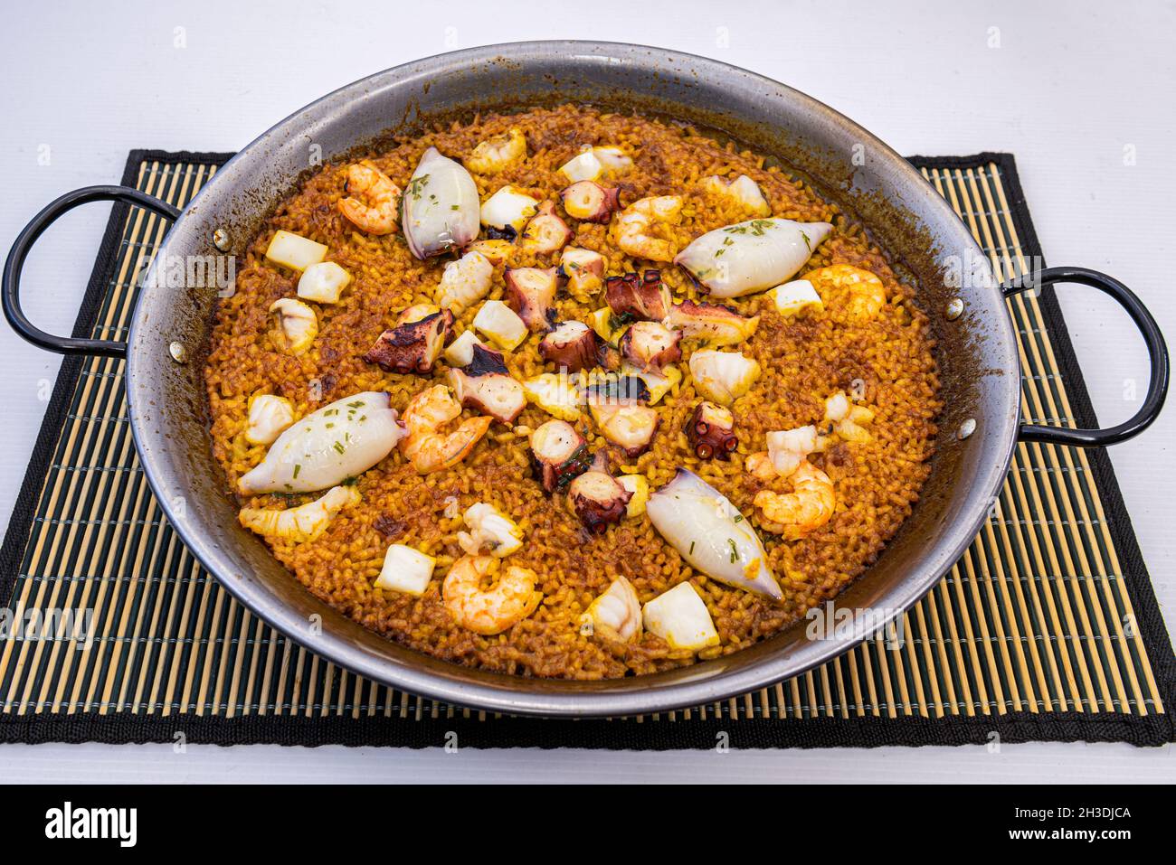 fantastic Spanish paella of seafood and cephalopods with octopus