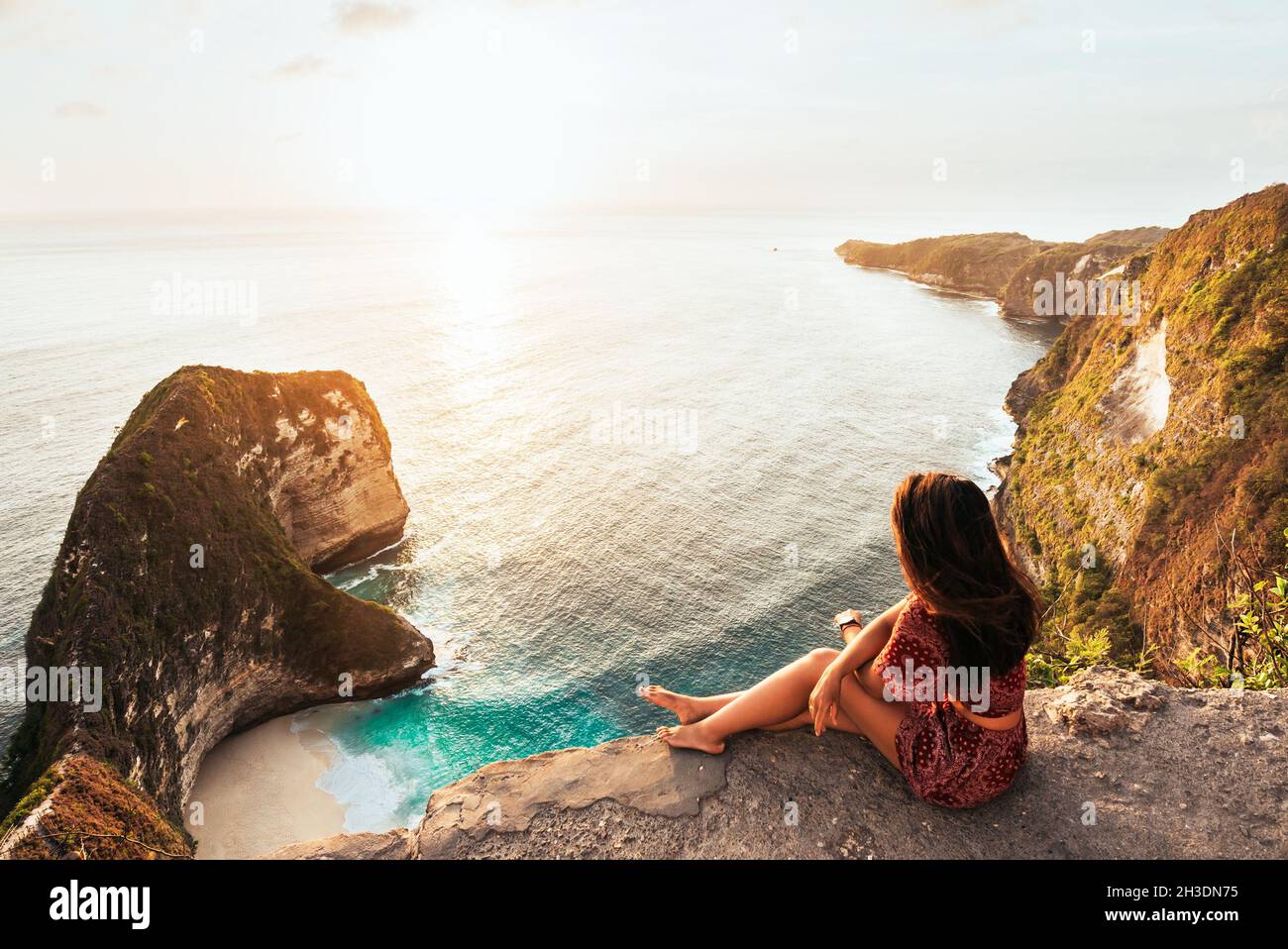Girl sitting on edge cliff hi-res stock photography and images - Alamy