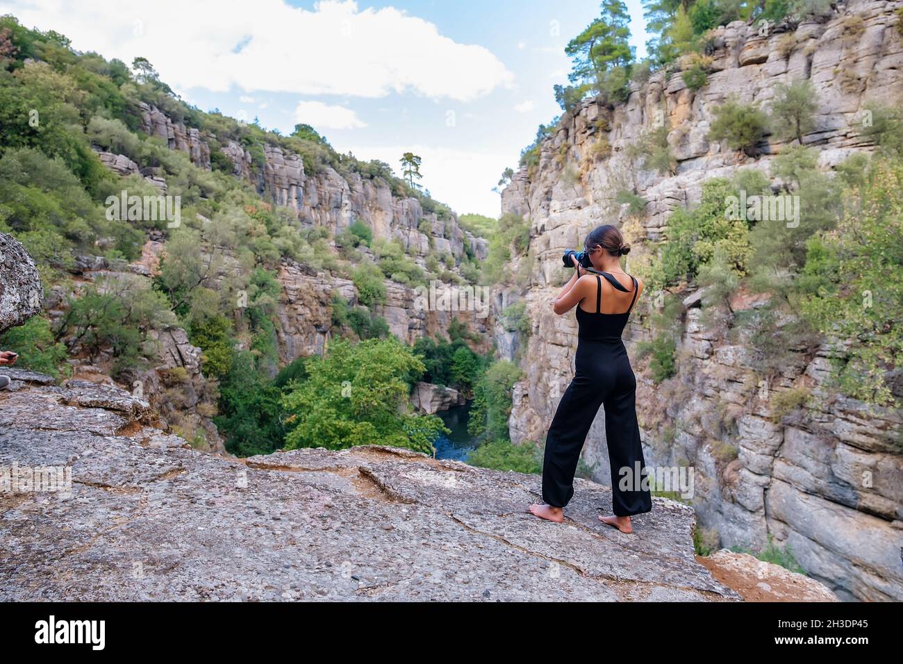 Woman on rocky mountain using hi-res stock photography and images - Alamy