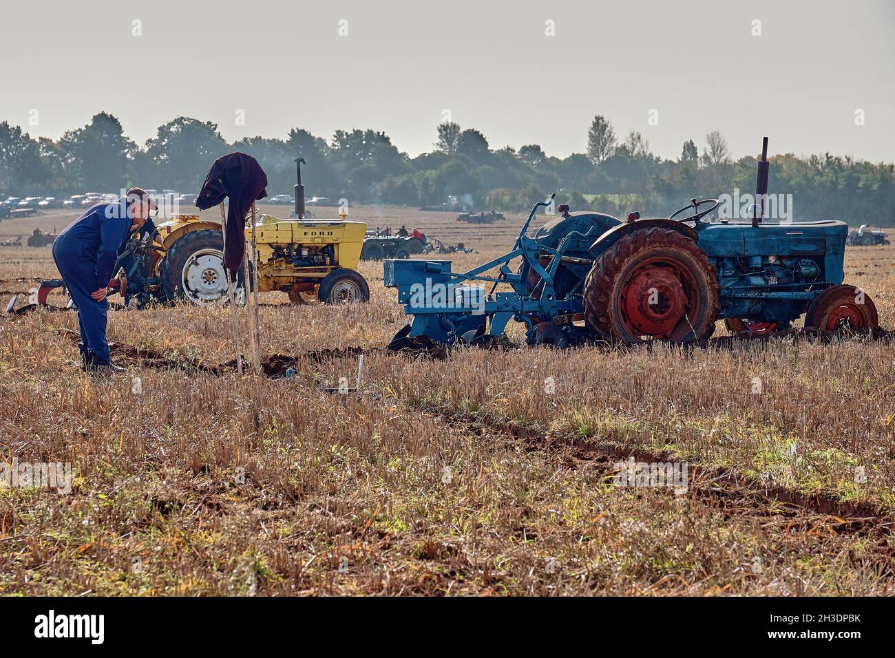 Side view of blue tractor and plough British Vintage Ploughing Match