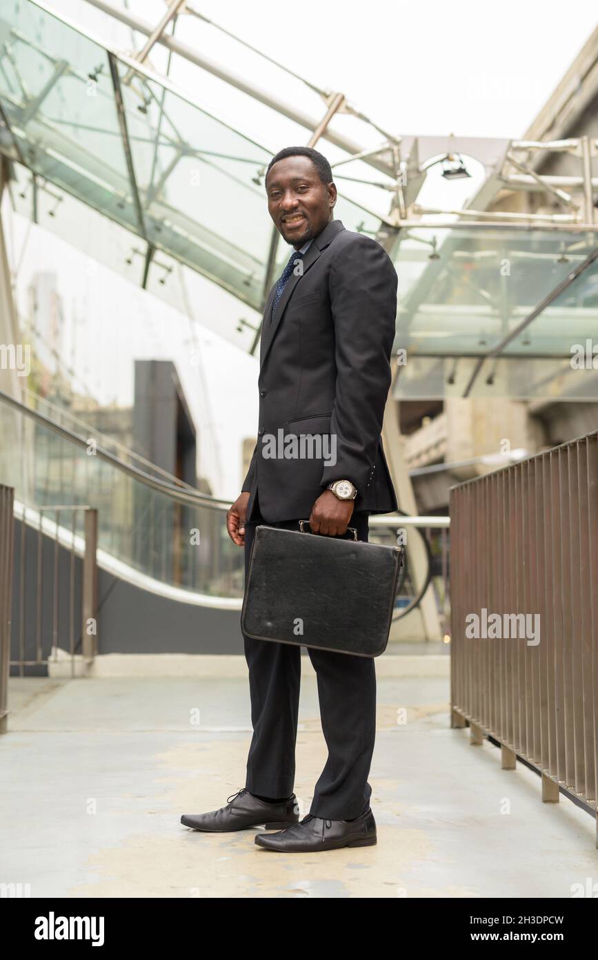 Portrait man walking bag hi-res stock photography and images - Alamy
