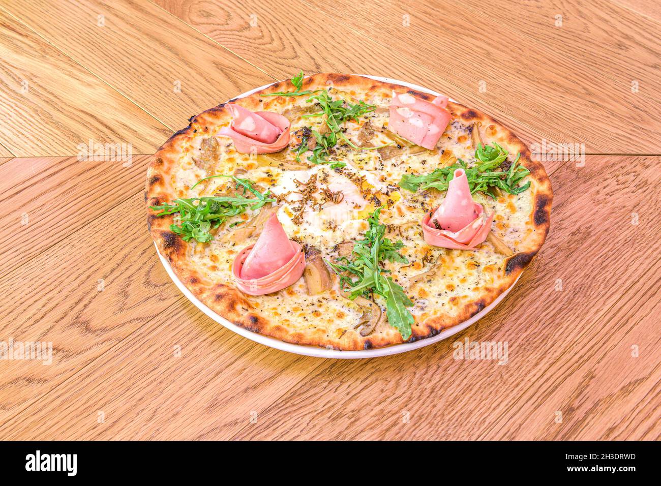 Gourmet Italian pizza with mozzarella cheese, thistle mushrooms