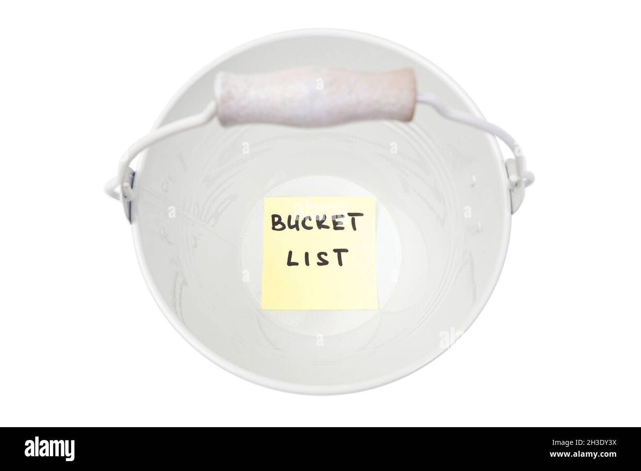 Empty bucket with a sticker note at the bottom reading BUCKET LIST. Stock Photo