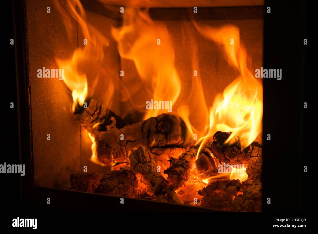 open fire in the living room, Austria Stock Photo