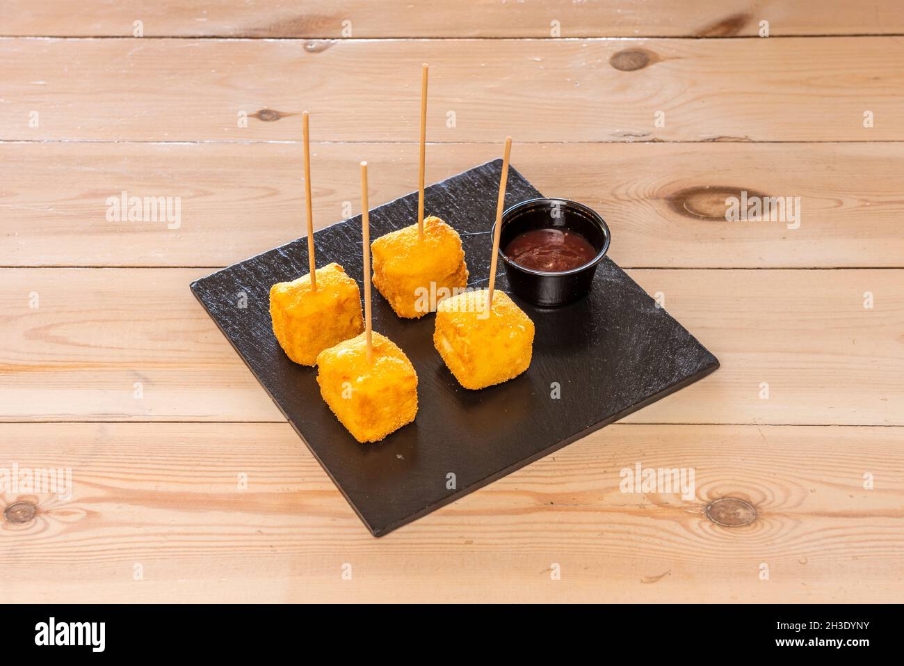 Brie cheese taco appetizer battered with breadcrumbs and egg with