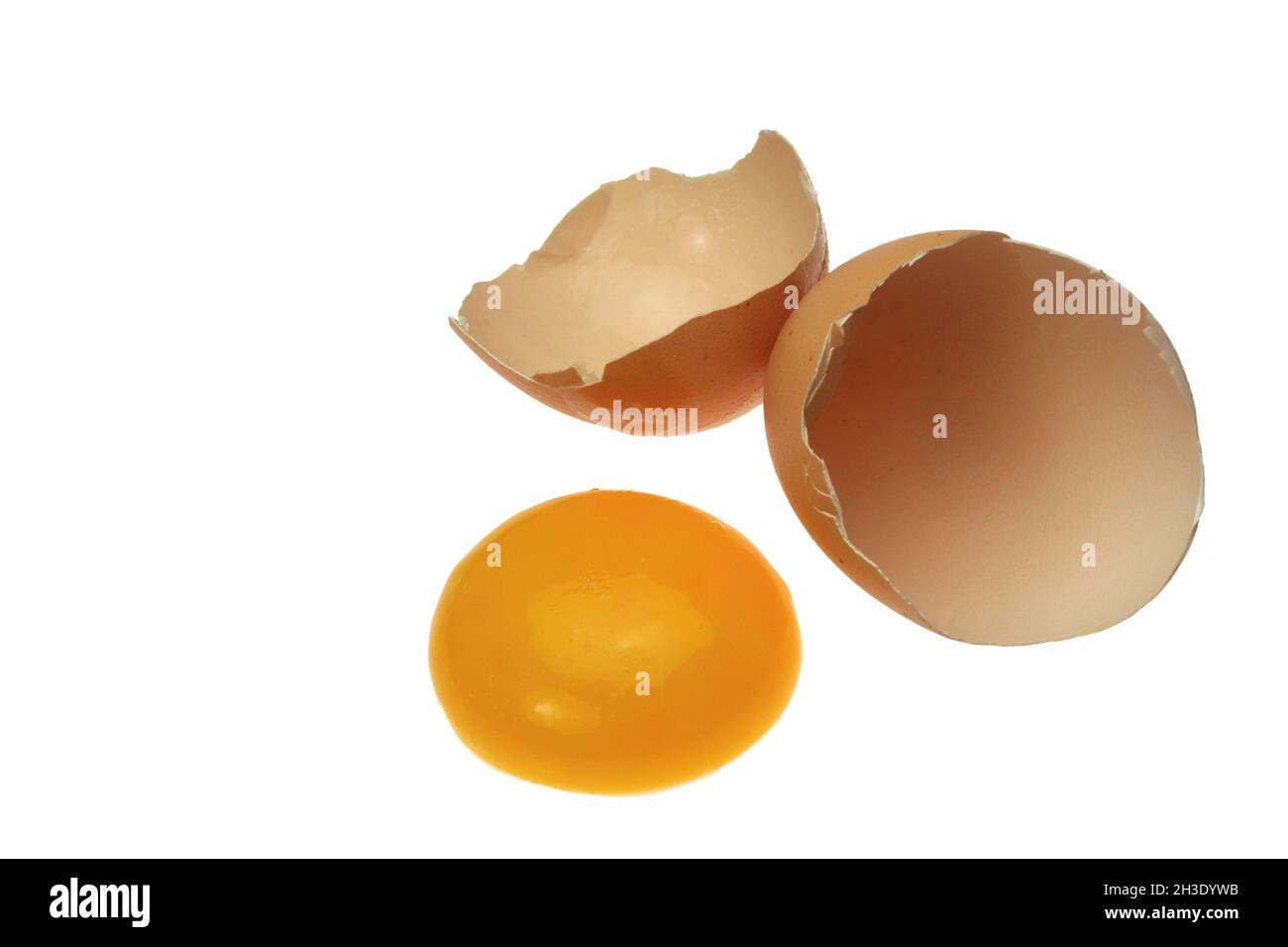 egg yolk and empty egg shell, cut-out Stock Photo