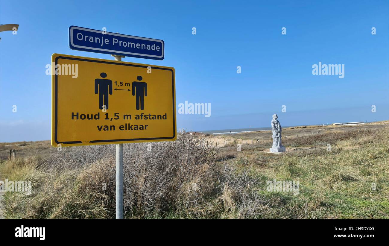 keep distance sign on the north sea dunes, Netherlands, Noordwijk aan Zee Stock Photo