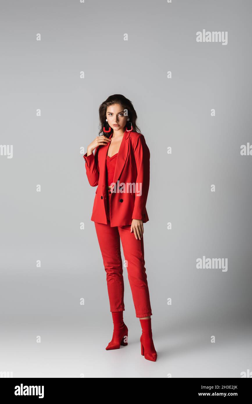Red boots grey suit hi-res stock photography and images - Alamy
