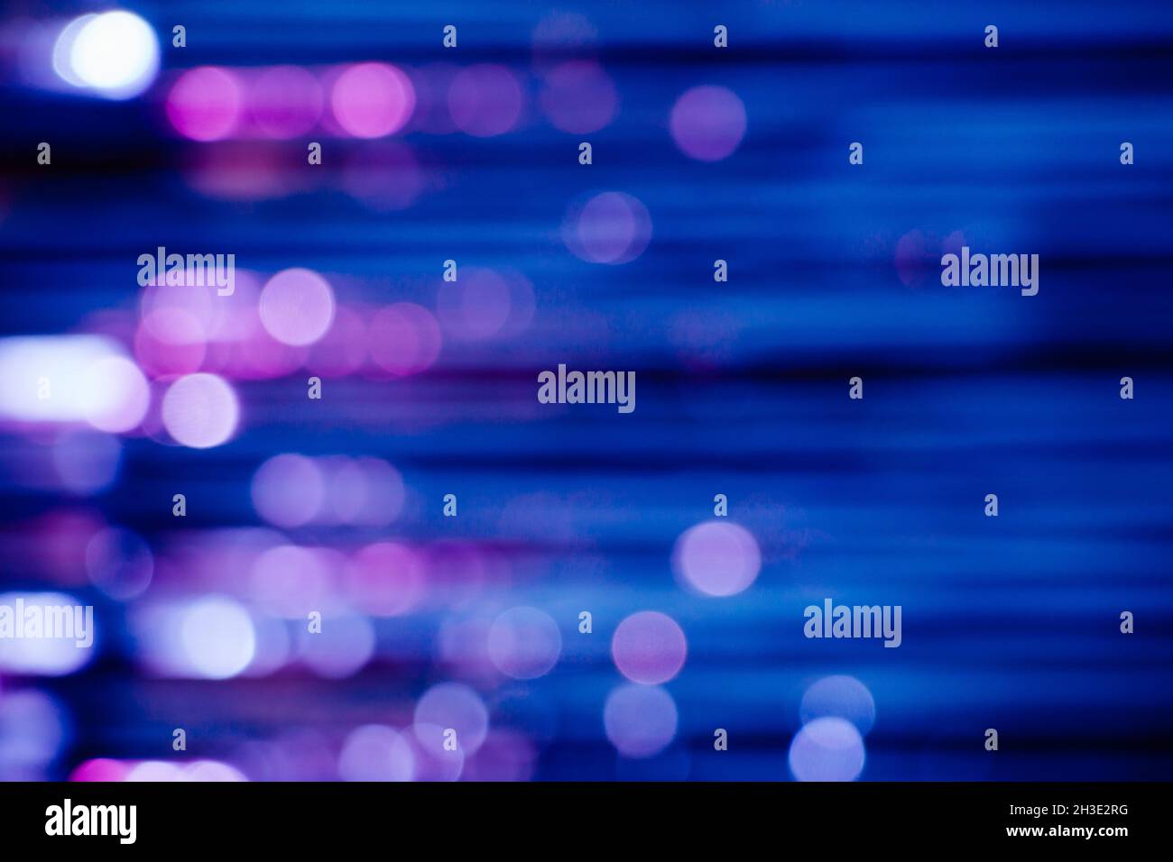 Abstract background with stripes and lights bookeh in blue and purple colors made of a glitter curtain Stock Photo