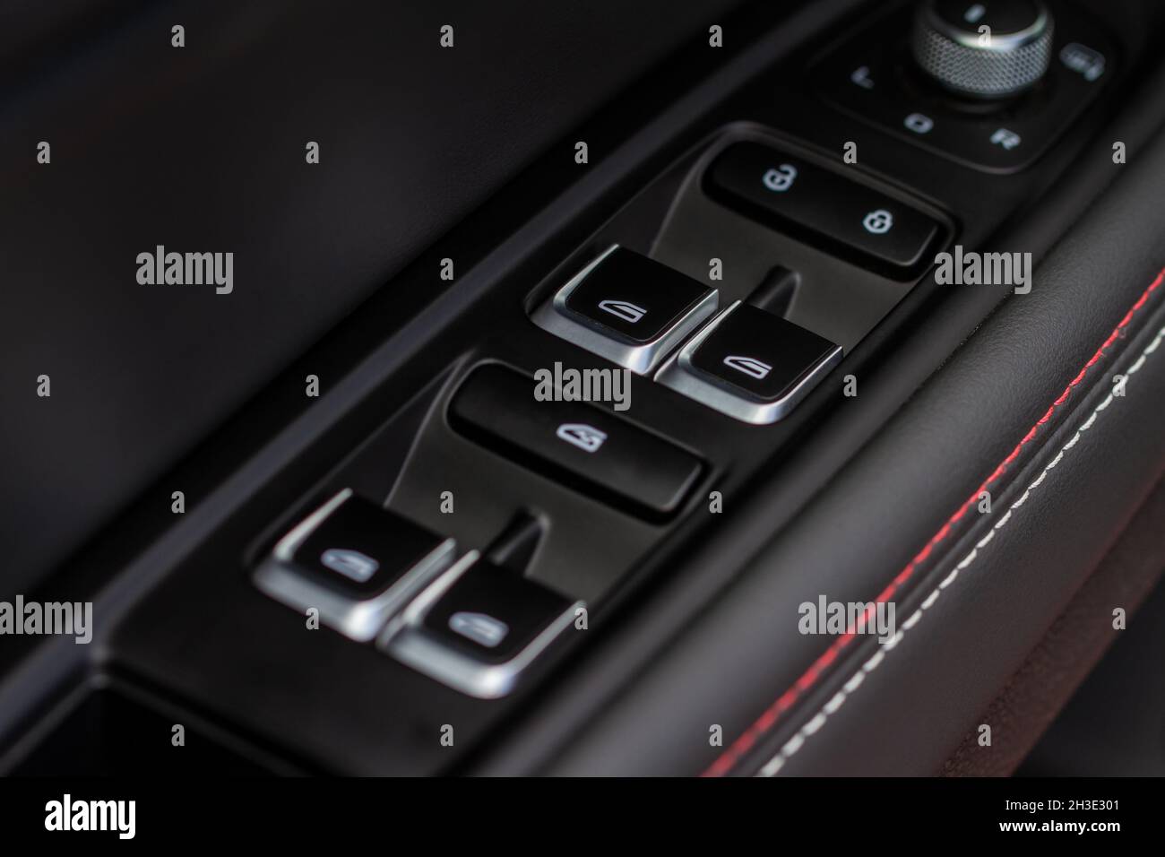 Close up view of button controlling window in modern car interior ...