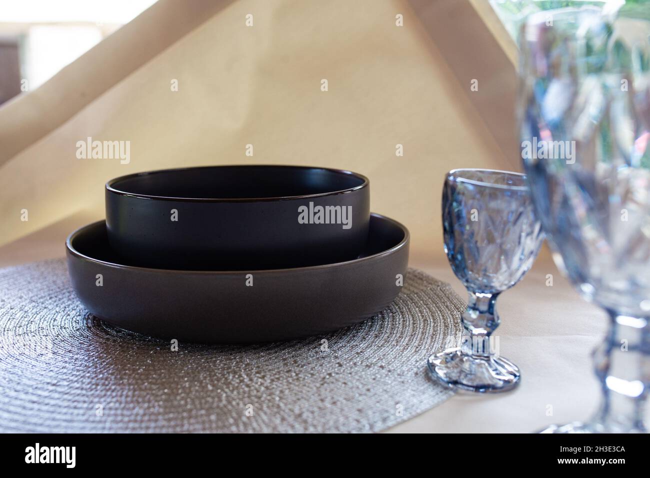 black deep soup plate on the table. Stock Photo