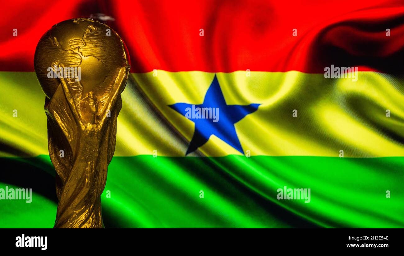 6 October 2021 Accra. FIFA World Cup against the background of the flag of Ghana. Stock Photo