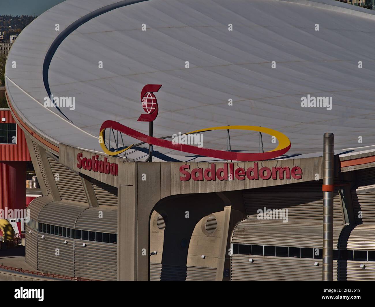 Closeup view of the roof of modern multi-use indoor arena Scotiabank Saddledome with company logo and lettering in Stampede Park, Calgary on sunny day. Stock Photo