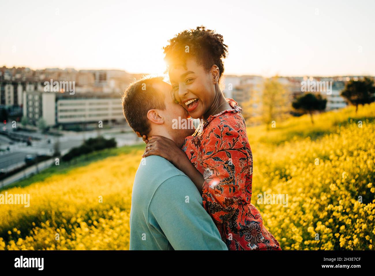 Side view of happy young African American Woman with short hair smiling ...