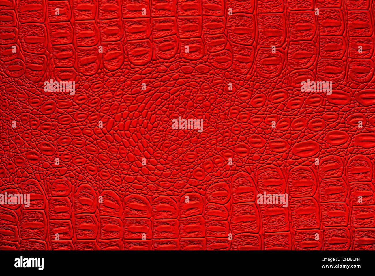 Red crocodile leather texture. Abstract background for design. Stock Photo