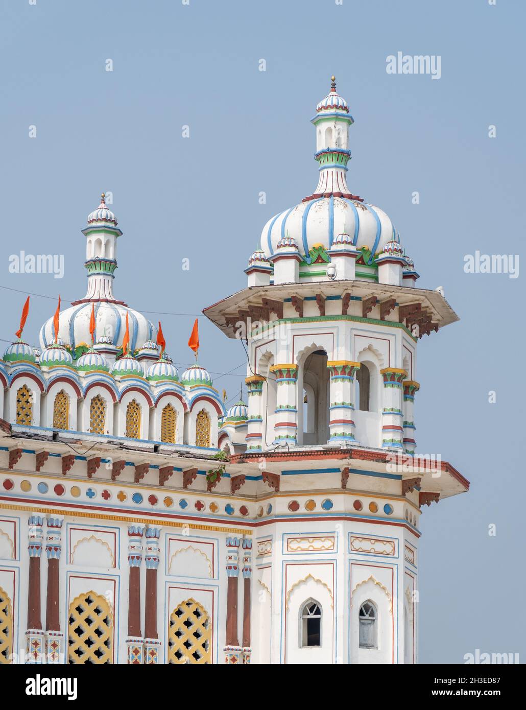 The colorful ornate Janaki Mandir Hindu Temple Domes architecture against a blue sky. Stock Photo