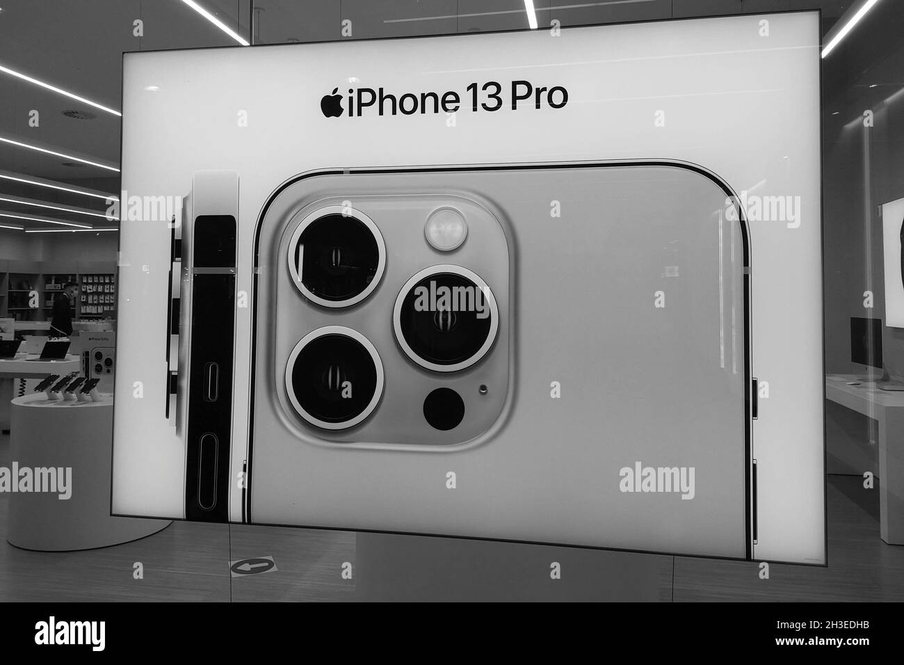 Iphone 13 Pro advertisement in a Rossellimac shop in Malaga, Andalusia, Spain. Stock Photo